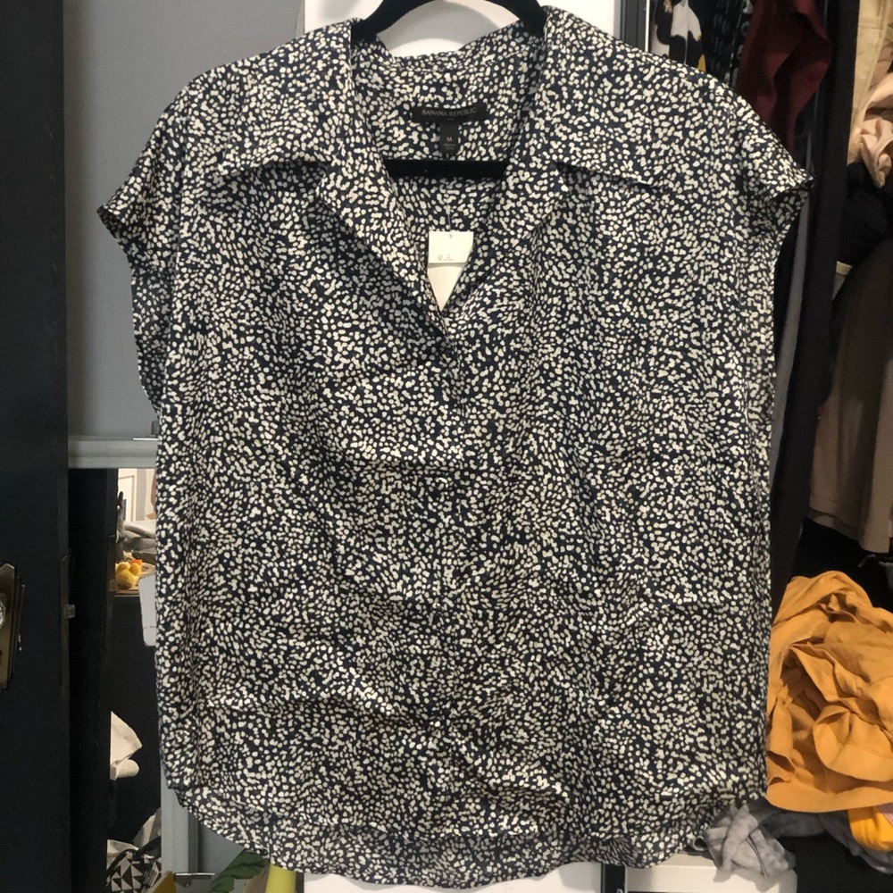 Short sleeved button down dotted blouse